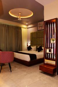 Ένα ή περισσότερα κρεβάτια σε δωμάτιο στο Hotel Mohan Palace