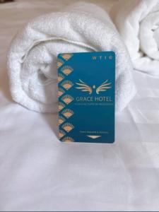 Postel nebo postele na pokoji v ubytování Khách sạn grace hotel dakmil