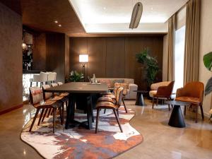 a dining room with a table and chairs at Pullman Riga Old Town - Renovated 2025 in Rīga +231 photos