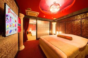 Postel nebo postele na pokoji v ubytování 大垣ホテルヴィヴィ