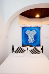 Ένα ή περισσότερα κρεβάτια σε δωμάτιο στο Villa 1908 Hikkaduwa +31 φωτογραφίες