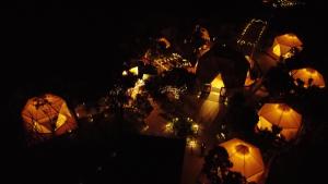an overhead view of tents at night with lights at Bluff Getaway Flinders Island Tasmania in Whitemark