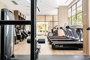 a gym with a row of treadmills at Laya Resort -Tropical Studio in Layan Beach +30 photos