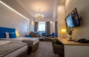 TV a/nebo společenská místnost v ubytování Hotel Arte