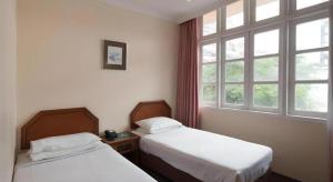 Ένα ή περισσότερα κρεβάτια σε δωμάτιο στο Penta Hotel