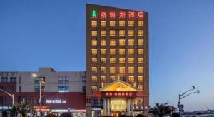 a tall building with lights on top of it at The Grace Hotel Shanghai Yexie in Linjiaqiao