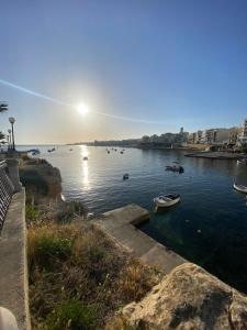 a view of a river with boats in the water at Ta Mary Apartment A Perfect St Pauls Bay Base in St Paul's Bay
