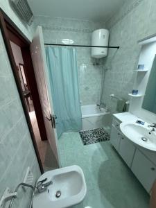a bathroom with a sink and a shower and a toilet at Ta Mary Apartment A Perfect St Pauls Bay Base in St Paul's Bay +19 photos