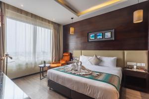 a hotel room with a bed and a window at Siddhartha Diyalo in Bīrganj