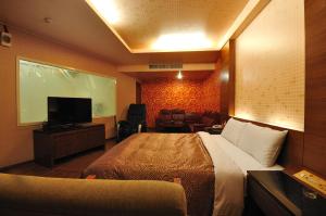 TV a/nebo společenská místnost v ubytování Hua Xiang Motel - Da Liao + 23 fotografií