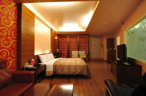 TV a/nebo společenská místnost v ubytování Hua Xiang Motel - Da Liao