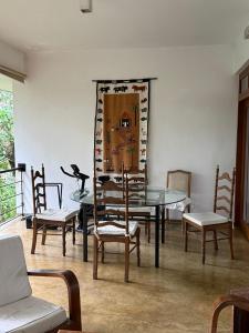 a dining room with a table and chairs at The Heights in Asgiriya in Kandy +17 photos
