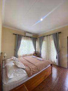 Ένα ή περισσότερα κρεβάτια σε δωμάτιο στο Opak Village Bed & Breakfast