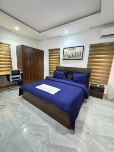 Postel nebo postele na pokoji v ubytování NewDawn Apartments