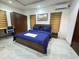 Postel nebo postele na pokoji v ubytování NewDawn Apartments