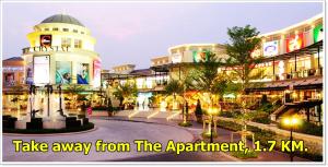 a building with a sign that says take away from the apartment at T3 Residence in Bangkok