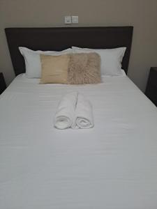 Postel nebo postele na pokoji v ubytování J&C Serenity Stay