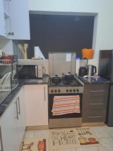 Kuchyň nebo kuchyňský kout v ubytování J&C Serenity Stay