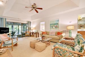 a living room filled with furniture and a ceiling fan at IC106: 106 Inlet Cove in Kiawah Island