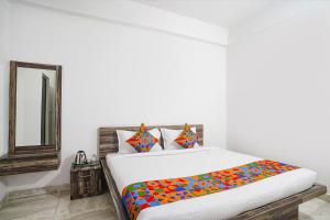 Postel nebo postele na pokoji v ubytování Hotel lord Jaggannath Plaza