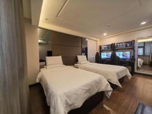 Ένα ή περισσότερα κρεβάτια σε δωμάτιο στο Shenzhen Nan Fei Yuan Hotel +157 φωτογραφίες