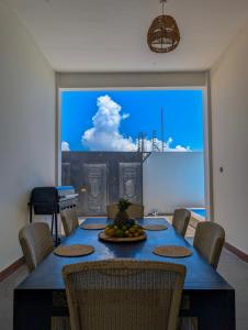 a dining room table with a bowl of fruit on it at Villa Goli Paje in Paje