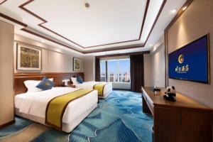 Postel nebo postele na pokoji v ubytování Chengdu Panda Base Zoo Shangli Hotel + 17 fotografií