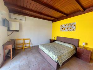 Ένα ή περισσότερα κρεβάτια σε δωμάτιο στο Oltremare