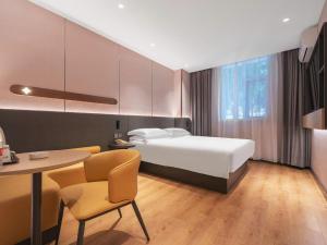 Ένα ή περισσότερα κρεβάτια σε δωμάτιο στο Jinjiang Inn Quanzhou West Street Kaiyuan Temple +243 φωτογραφίες