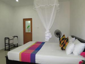 Postel nebo postele na pokoji v ubytování Sigiriya Amenity Home Stay