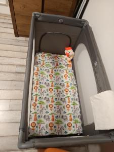 an open suitcase with a stuffed animal in it at Golden Apartman in Orosháza