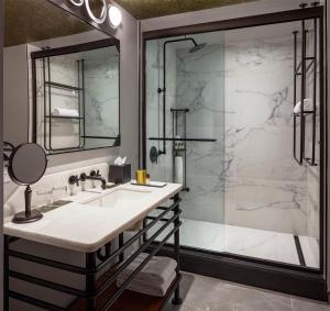 a bathroom with a sink and a shower at Holston House Nashville, in The Unbound Collection by Hyatt in Nashville +49 photos
