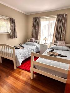 Ένα ή περισσότερα κρεβάτια σε δωμάτιο στο Checketts Bungalow in Halswell +29 φωτογραφίες