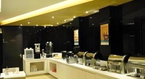 Příslušenství pro přípravu čaje a kávy v ubytování Jinjiang Inn Jiaozuo Gymnasium