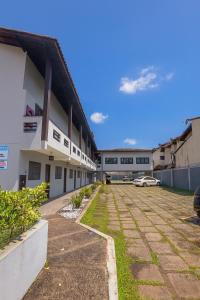 an empty parking lot in front of a building at Flat juquehy L&H in Juquei