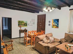 a living room with a couch and a table at Casa Deocano in Fuenteheridos