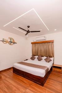 Ένα ή περισσότερα κρεβάτια σε δωμάτιο στο FLY VIEW Airport Residency