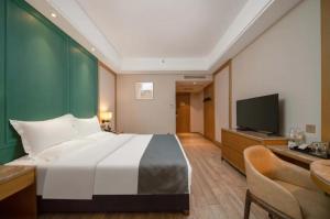 Μια τηλεόραση ή/και κέντρο ψυχαγωγίας στο World Hotel Jinan Harmony Plaza Qilu Children's Hospital Branch