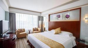 TV a/nebo společenská místnost v ubytování Star City Hotel Zhuhai