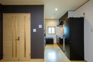 Kuchyň nebo kuchyňský kout v ubytování バンビホーム青森中央 + 9 fotografií