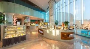 a large building with a bakery with a lot of pastries at Fliport Hotel Zhangzhou Yuanshan in Zhangzhou