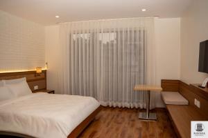 Postel nebo postele na pokoji v ubytování Navaya Residence