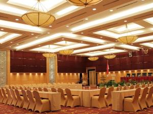 a large banquet hall with a long table and chairs at Grand Basko Hotel in Minangkabau International Airport +233 photos
