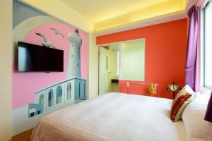 Postelja oz. postelje v sobi nastanitve Love in Hengchun B&B