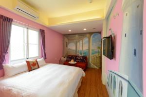 Postelja oz. postelje v sobi nastanitve Love in Hengchun B&B