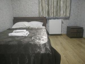 Rúm í herbergi á Hotel Mimino