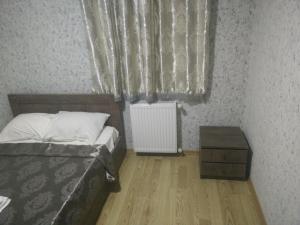 Rúm í herbergi á Hotel Mimino