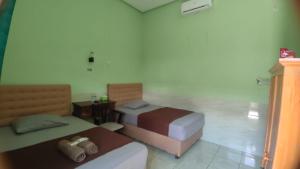 Ένα ή περισσότερα κρεβάτια σε δωμάτιο στο Hotel Antik +2 φωτογραφίες