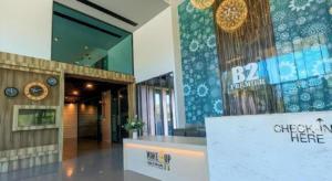 a lobby of a building with a clock on the wall at B2 Krabi Premier Hotel in Ban Na Nok (1) +235 photos