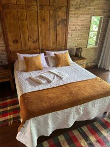 Postel nebo postele na pokoji v ubytování Chalé Rústico 2 - Retiro Andaluz